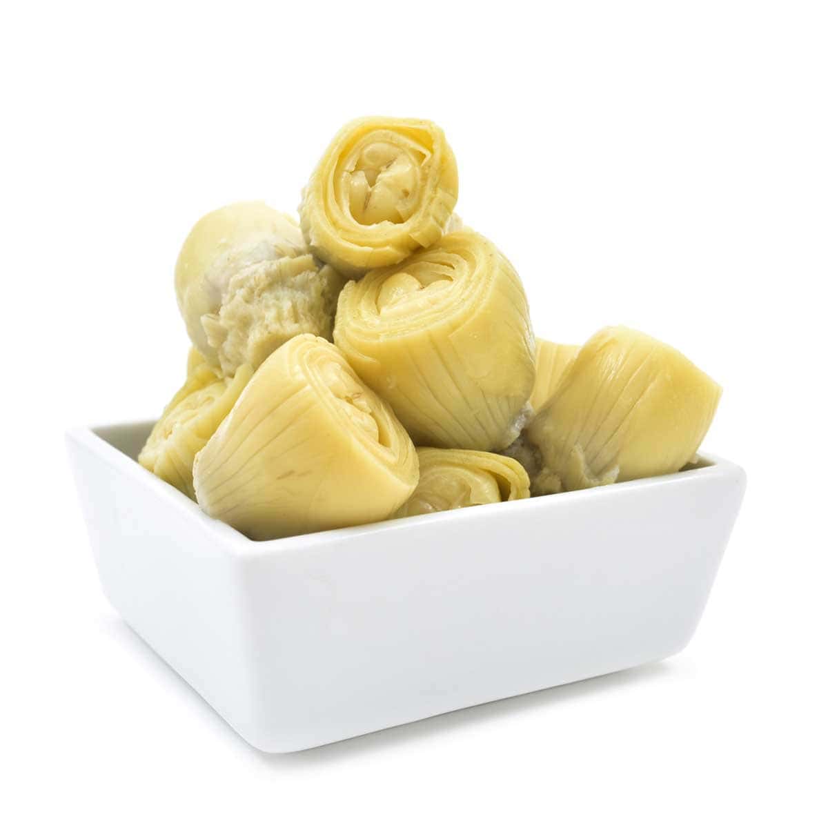 A dozen artichoke hearts in a white dish.