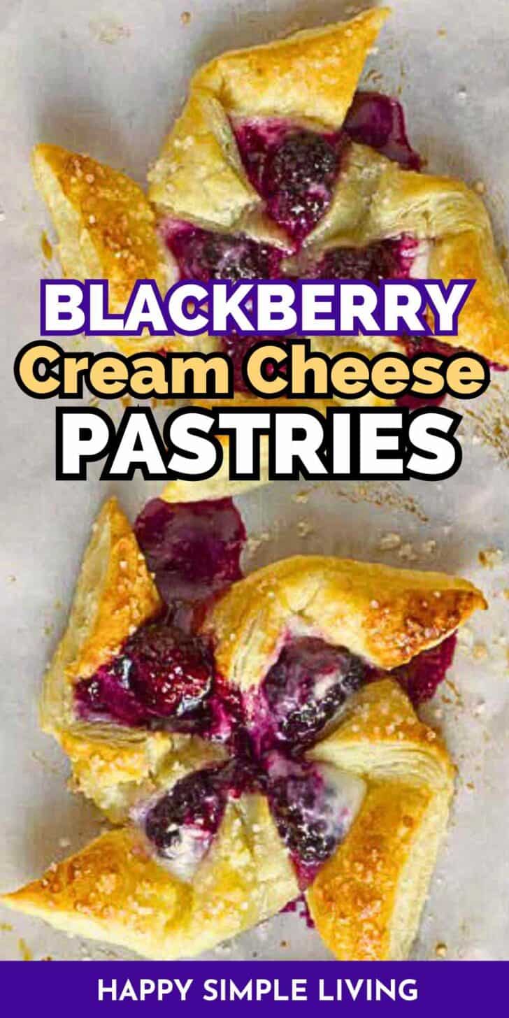 Two blackberry cream cheese pastries on a baking sheet.