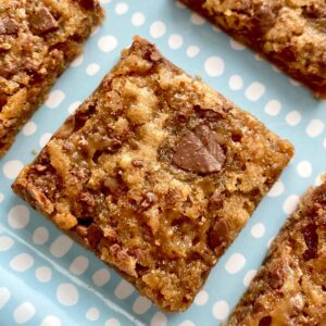 Close up of four chewy toffee blondies bar cookies.