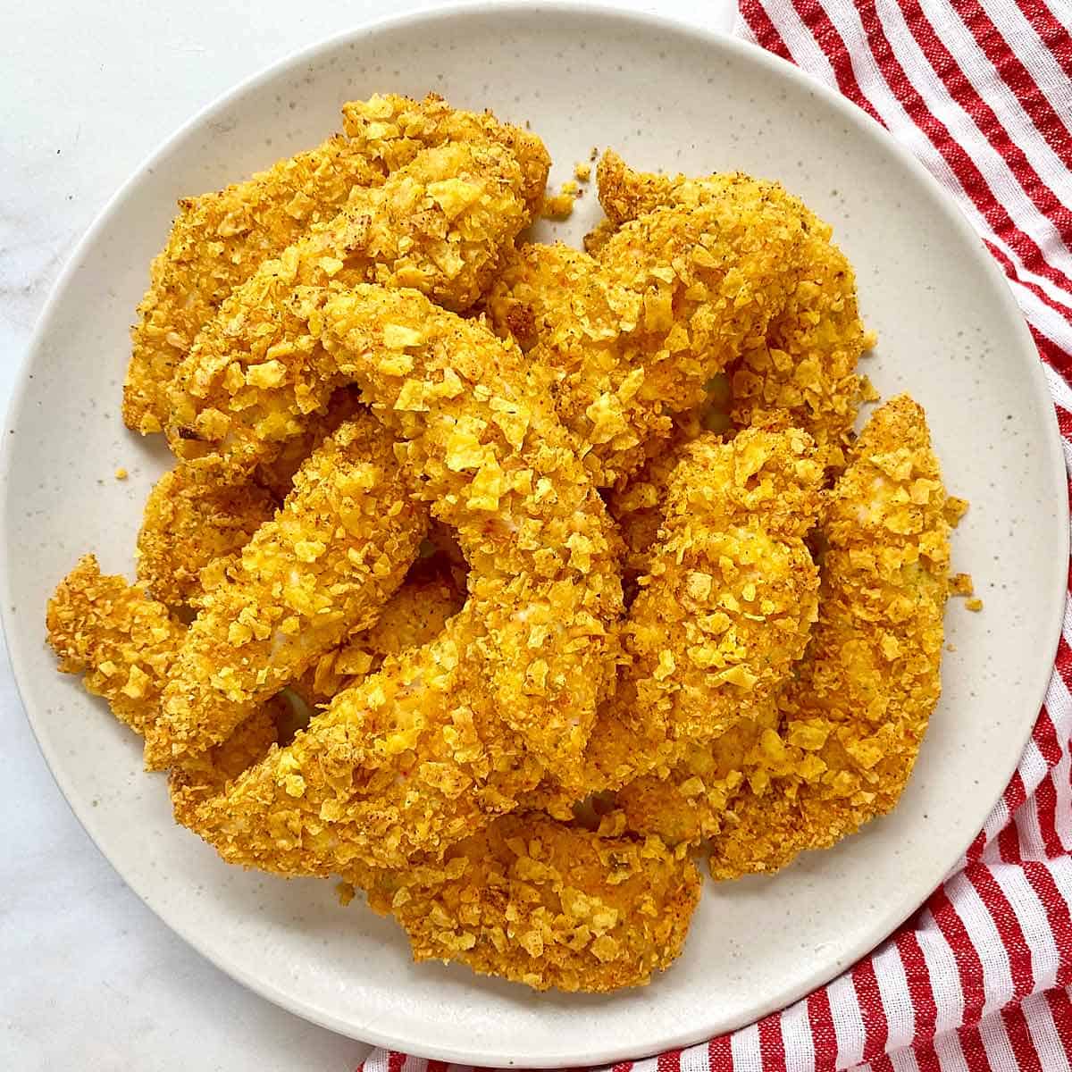 Crispy Cool Ranch Doritos chicken tenders on a white plate.