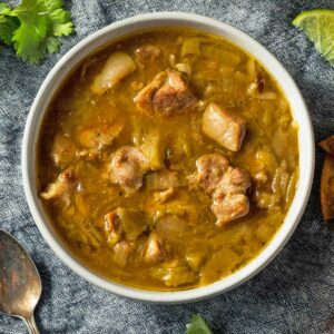 A white bowl filled with fire roasted green chile.