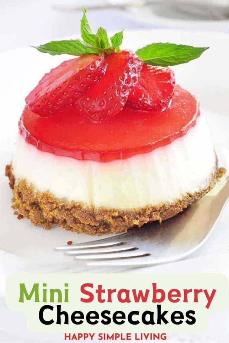 A mini strawberry cheesecake on a fork.