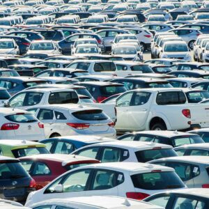 a very crowded parking lot filled with cars.