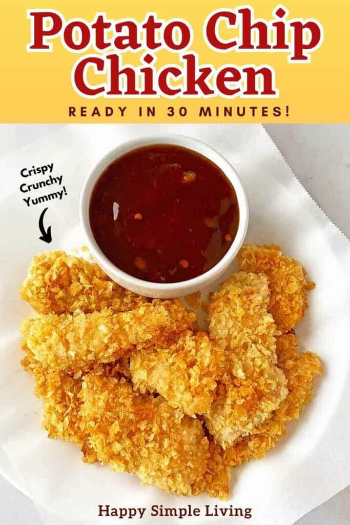 Potato chip chicken tenders on a white platter with dipping sauce.