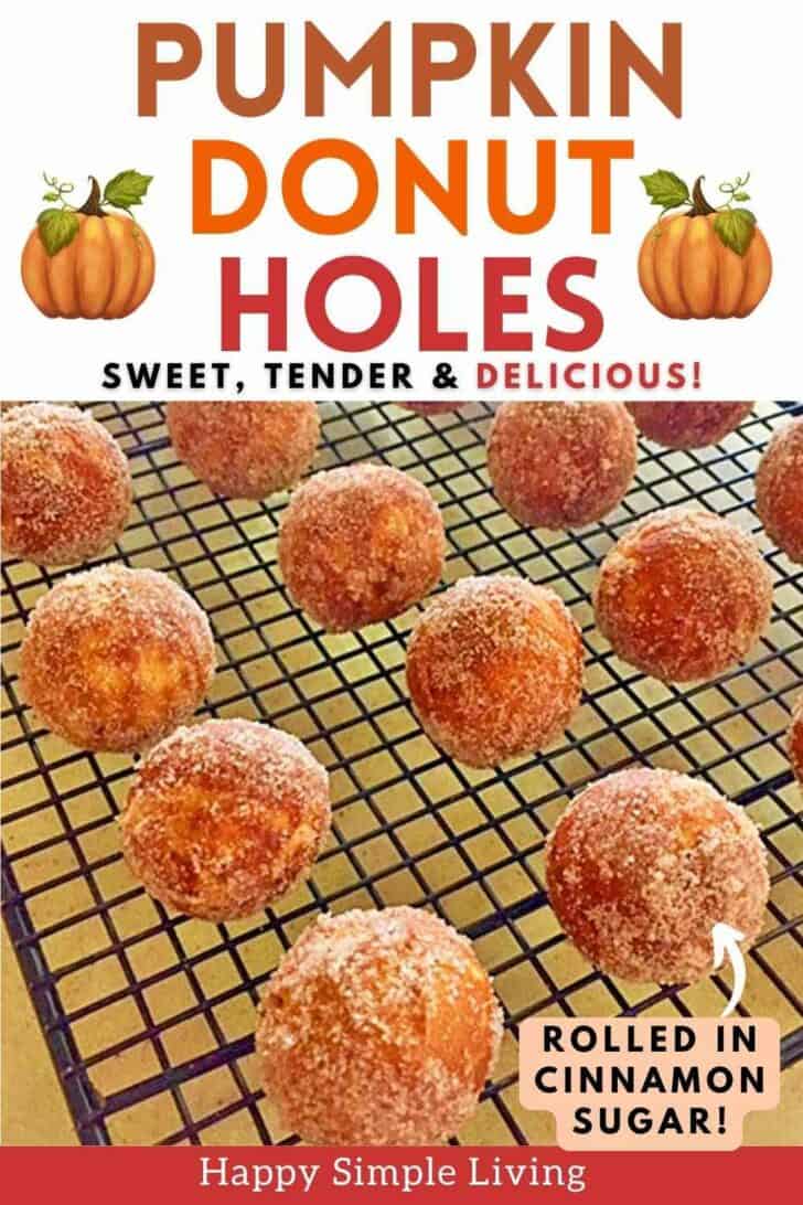 Pumpkin spice donut holes rolled in cinnamon sugar on a cooling rack.