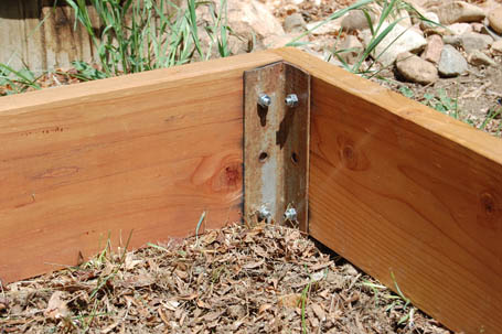 Corner of cedar raised garden showing how hardware is attached.